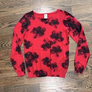 Faded glory red sweater with black flowers and sequins.